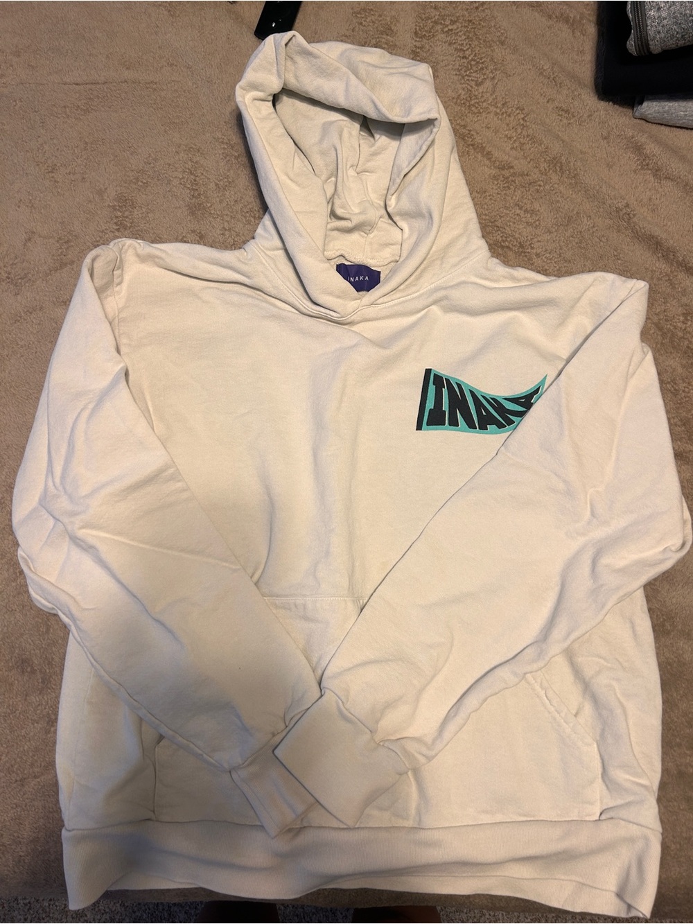 Inaka Power Cream Hoodie with Teal Logo